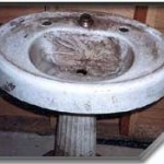 This pedestal sink is sure in need of our porcelain repair expertise.