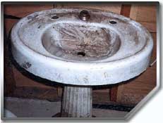 This pedestal sink is sure in need of our porcelain repair expertise.